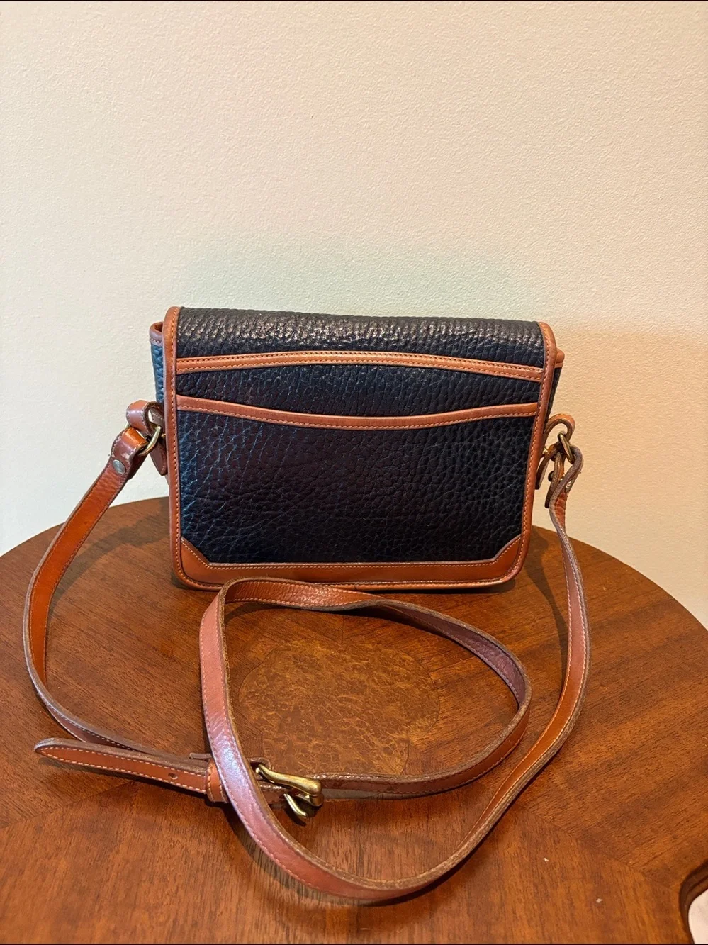Dooney & Bourke All weather Leather Crossbody bag thick leather black/brown EUC